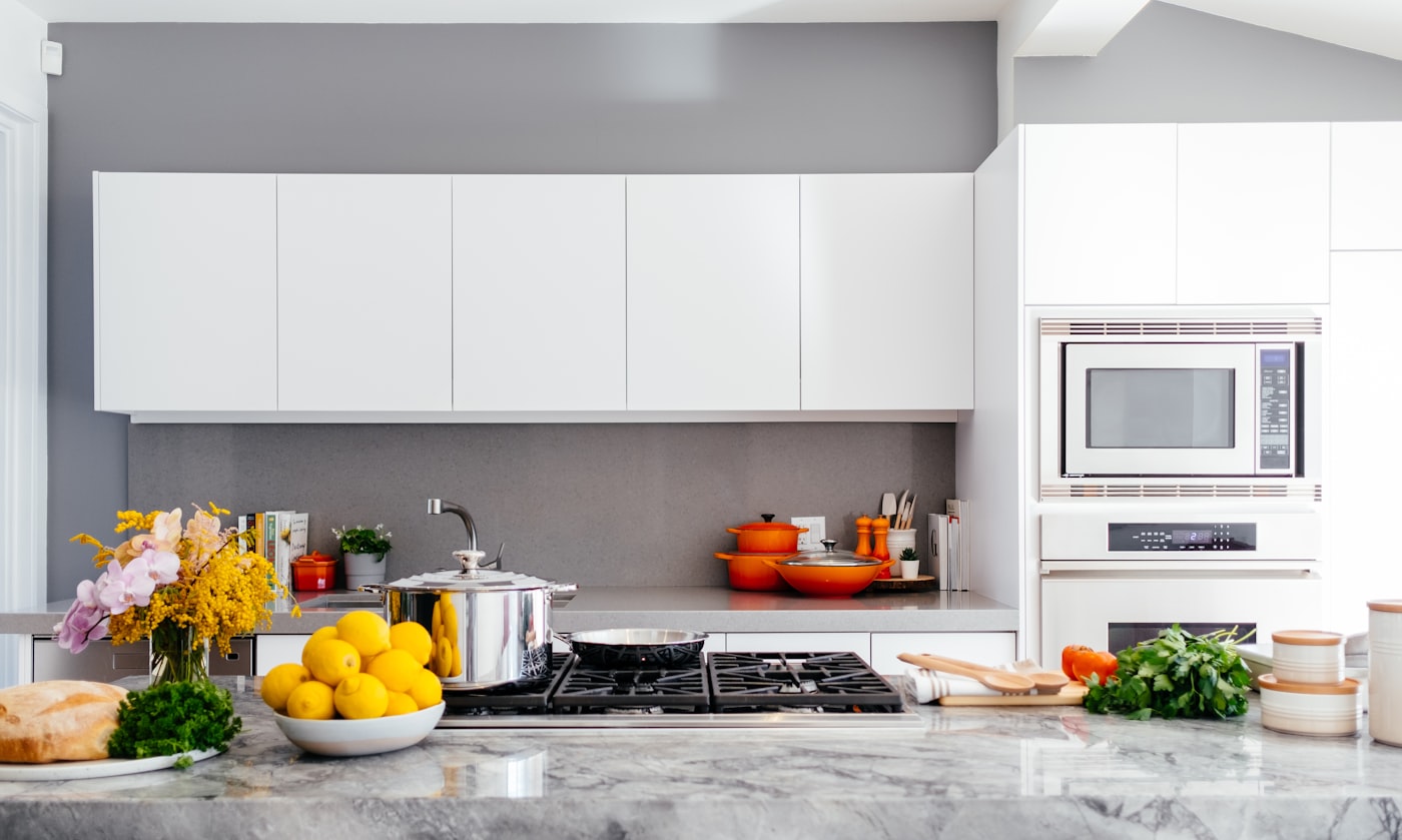 Editors comparing kitchen and travel products on a review table